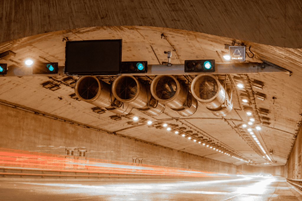 Quantum-inspired optimisation for traffic and tunnel systems